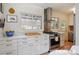 Modern kitchen featuring white countertops, stainless steel appliances, and a stylish backsplash at 2965 S Gilpin St, Denver, CO 80210