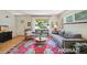 Comfortable living room featuring a stylish rug, ample seating, and natural light at 2965 S Gilpin St, Denver, CO 80210