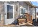 Cozy porch with white door and a window at 6521 E 70Th Pl, Commerce City, CO 80022