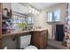 Functional bathroom with a sink and vanity plus a window at 6521 E 70Th Pl, Commerce City, CO 80022