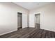 Bedroom featuring modern wood flooring, closet, and neutral paint tones throughout the space at 6521 E 70Th Pl, Commerce City, CO 80022