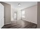 Bedroom featuring modern wood flooring, a window and neutral paint tones throughout the space at 6521 E 70Th Pl, Commerce City, CO 80022