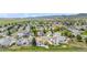 Extensive aerial view of the community with vast open spaces and picturesque mountain views at 9651 Bighorn Way, Littleton, CO 80125