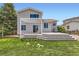 Spacious backyard featuring a large deck and a well-maintained lawn perfect for outdoor entertaining and relaxation at 9651 Bighorn Way, Littleton, CO 80125