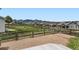 Picturesque backyard with lush green space, a fenced perimeter, and stunning mountain views in the distance at 9651 Bighorn Way, Littleton, CO 80125