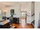 Inviting entryway with hardwood floors, leading to a dining area and staircase at 9651 Bighorn Way, Littleton, CO 80125