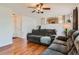 Spacious living room with hardwood floors and a comfortable sectional sofa at 9651 Bighorn Way, Littleton, CO 80125