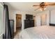 Cozy main bedroom featuring a ceiling fan, walk-in closet, and ample storage space for comfortable living at 9651 Bighorn Way, Littleton, CO 80125
