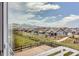 Scenic view of a suburban neighborhood with charming houses and stunning mountain backdrop on a beautiful day at 9651 Bighorn Way, Littleton, CO 80125