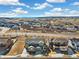 Community aerial view showcasing the neighborhood layout and surrounding landscape on a sunny day at 1526 Golden Sill Dr, Castle Pines, CO 80108