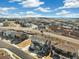 Community aerial view showcasing the neighborhood layout and surrounding landscape on a sunny day at 1526 Golden Sill Dr, Castle Pines, CO 80108