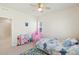 Bedroom with a pink play tent, toy kitchen, and colorful rug at 1526 Golden Sill Dr, Castle Pines, CO 80108