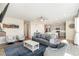 Spacious living room featuring hardwood floors, recessed lighting, and an open view to the kitchen at 1526 Golden Sill Dr, Castle Pines, CO 80108