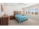 Primary bedroom with plantation shutters, a ceiling fan, and beautiful views at 1526 Golden Sill Dr, Castle Pines, CO 80108