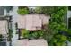 Birds-eye view of the home's roof, mature trees, and backyard patio space at 7444 E 9Th Ave, Denver, CO 80230