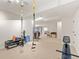 Large finished basement with fitness area featuring exercise machines and equipment at 7444 E 9Th Ave, Denver, CO 80230