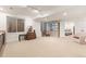 Spacious basement area with a kitchenette, display cabinet, and access to another room at 7444 E 9Th Ave, Denver, CO 80230