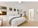 Bedroom with bright windows, plush carpeting, an en suite bathroom, and ample natural light at 7444 E 9Th Ave, Denver, CO 80230