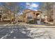 Attractive two-story home featuring neat landscaping and an arched entryway at 7444 E 9Th Ave, Denver, CO 80230