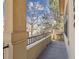 Cozy front porch with stone pillars, wrought iron railing, and neighborhood views at 7444 E 9Th Ave, Denver, CO 80230