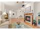 Hardwood floors, a fireplace, and plush seating define the inviting living room perfect for relaxation and conversation at 7444 E 9Th Ave, Denver, CO 80230