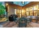 Cozy outdoor patio space with patio table, chairs, and swing seating for relaxing and entertaining at 7444 E 9Th Ave, Denver, CO 80230