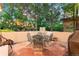 Cozy outdoor patio with a wrought iron table set and string lights overhead, perfect for entertaining at 7444 E 9Th Ave, Denver, CO 80230