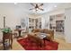 A cozy sitting room with built-in shelves, a ceiling fan, and a red rug at 7444 E 9Th Ave, Denver, CO 80230