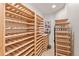 Climate-controlled wine cellar with wooden racks and tile floor at 7444 E 9Th Ave, Denver, CO 80230