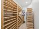 Custom wine cellar with natural wood shelving for ample storage at 7444 E 9Th Ave, Denver, CO 80230