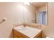 Clean bathroom with a single sink vanity and tiled walls at 229 Bross St # D, Longmont, CO 80501