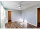 Bedroom with grey walls and wood flooring at 229 Bross St # D, Longmont, CO 80501