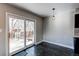 Bright dining area with sliding glass doors leading to the backyard at 229 Bross St # D, Longmont, CO 80501