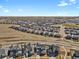 Panoramic aerial of the residential community with well-maintained homes and manicured lawns at 1180 Ascent Trail Cir, Erie, CO 80516