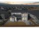 Aerial view of backyard, showcasing outdoor seating and mountain views at 1180 Ascent Trail Cir, Erie, CO 80516