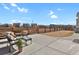 Outdoor patio with furniture overlooking the fenced yard at 1180 Ascent Trail Cir, Erie, CO 80516