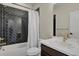 Modern bathroom with black herringbone tiled shower and stylish vanity at 1180 Ascent Trail Cir, Erie, CO 80516