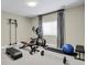 Home gym featuring exercise equipment, workout bench, and natural light at 1180 Ascent Trail Cir, Erie, CO 80516