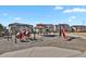 A neighborhood playground featuring various play structures, swings, and a gazebo for community enjoyment at 1180 Ascent Trail Cir, Erie, CO 80516