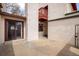 Private back patio with stucco exterior, sliding glass doors, and access to a balcony at 1321 Madero St, Broomfield, CO 80020
