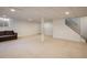 Spacious finished basement with carpet, neutral walls, and natural light at 1321 Madero St, Broomfield, CO 80020
