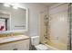 Cozy bathroom features a shower-tub combo with tiled walls, along with a vanity sink and toilet at 1321 Madero St, Broomfield, CO 80020