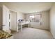 Bright bedroom featuring a loft bed, plush carpeting, and a large window for ample natural light at 1321 Madero St, Broomfield, CO 80020