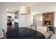 Open dining area with stylish lighting, seamlessly connecting to the kitchen and living spaces at 1321 Madero St, Broomfield, CO 80020