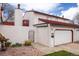 Charming home exterior with red tile roof, attached garage, and wrought iron gate, offering curb appeal at 1321 Madero St, Broomfield, CO 80020