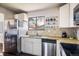 Efficient kitchen layout featuring stainless steel appliances, granite countertops, and ample cabinet space at 1321 Madero St, Broomfield, CO 80020