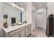 Bathroom featuring a double vanity and modern lighting at 26902 E Ellsworth Ave, Aurora, CO 80018