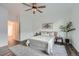 A bright bedroom featuring a ceiling fan and neutral decor at 26902 E Ellsworth Ave, Aurora, CO 80018