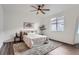 A bright bedroom features a large window and neutral decor at 26902 E Ellsworth Ave, Aurora, CO 80018