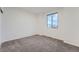 Carpeted bedroom with natural light and a spacious interior at 26902 E Ellsworth Ave, Aurora, CO 80018